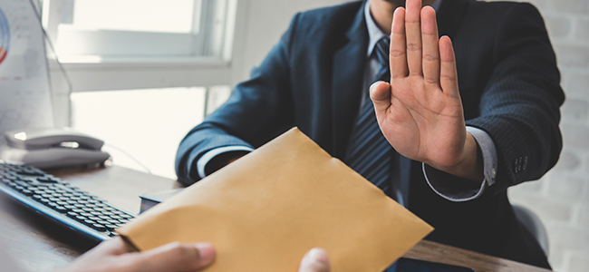 businessman rejecting money in the envelope anti bribery and c
